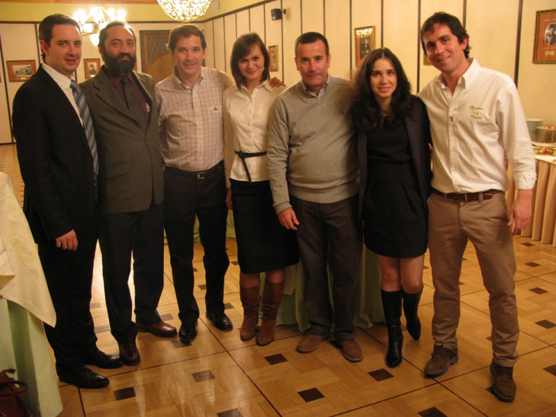 Interpreters A. Konurbaeva, A. Ermanok with the olive oil producers during the Chile Olive oil salon in Moscow.